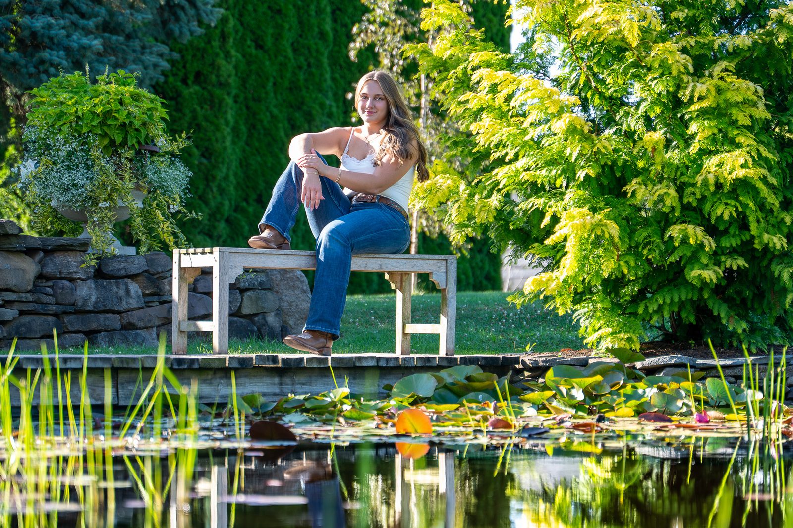 Senior portrait by a garden pond, Rochester NY