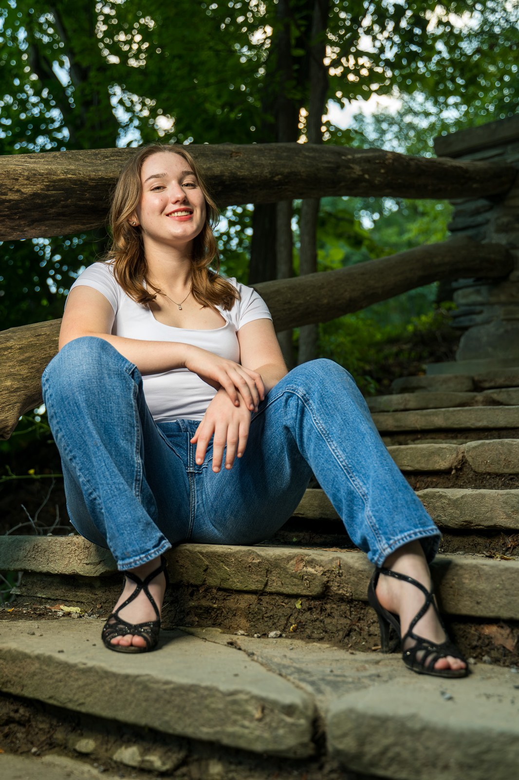 Senior portrait on stone steps, Rochester NY