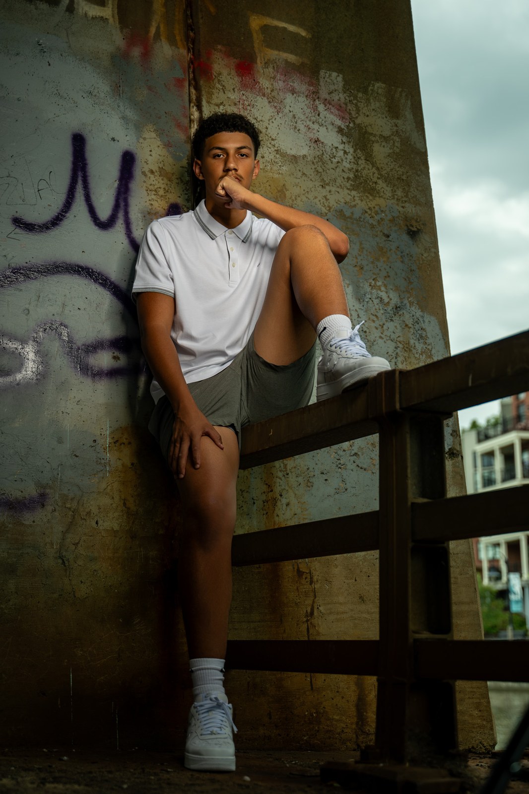 Senior portrait against a mural wall, Rochester NY
